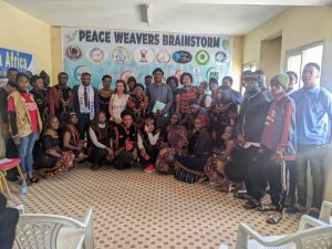 Family picture of leaders during the Peace Weavers Brainstorm